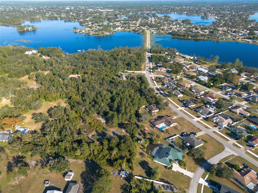 2078 Elkcam Boulevard Deltona, FL 32725 - Photo 16 of 36 an aerial view of residential building with ocean view
