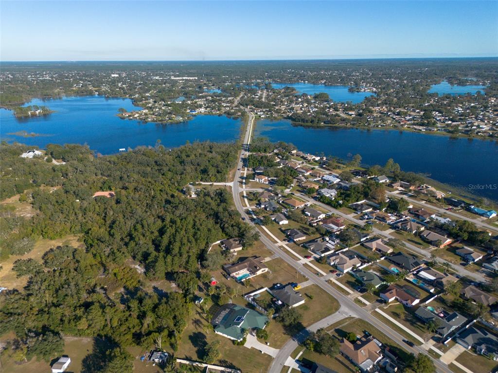 2078 Elkcam Boulevard Deltona, FL 32725 - Photo 29 of 36 an aerial view of a city with lots of residential buildings