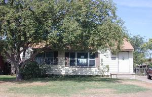 4624 Preston Street Amarillo, TX 79110 - Photo 1 of 1 a front view of a house with a yard