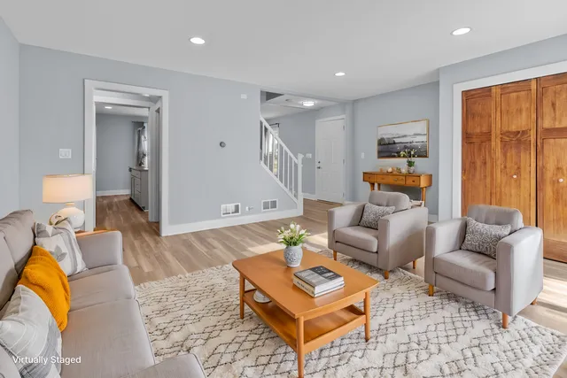 a view of a livingroom with wooden floor and a window