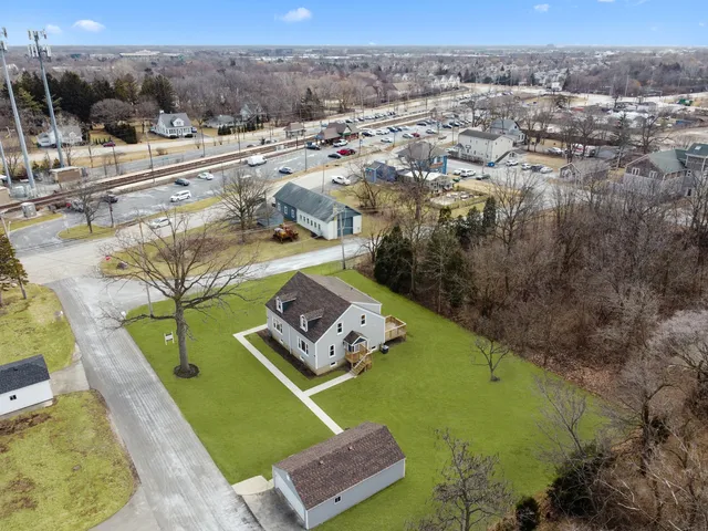 a view of entryway with wooden floor and stairs