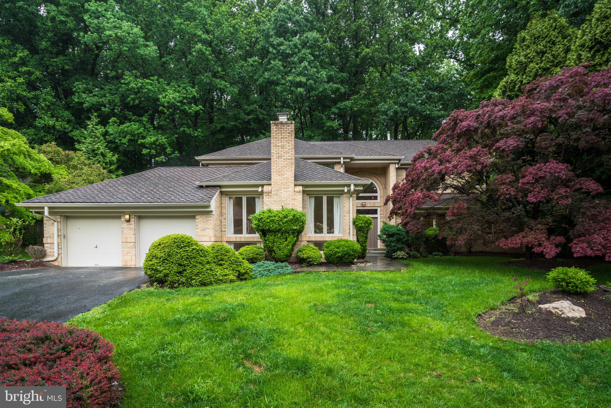 7805 Laurel Leaf Drive Potomac, MD 20854 - Photo 1 of 13 a view of a house with a yard and potted plants