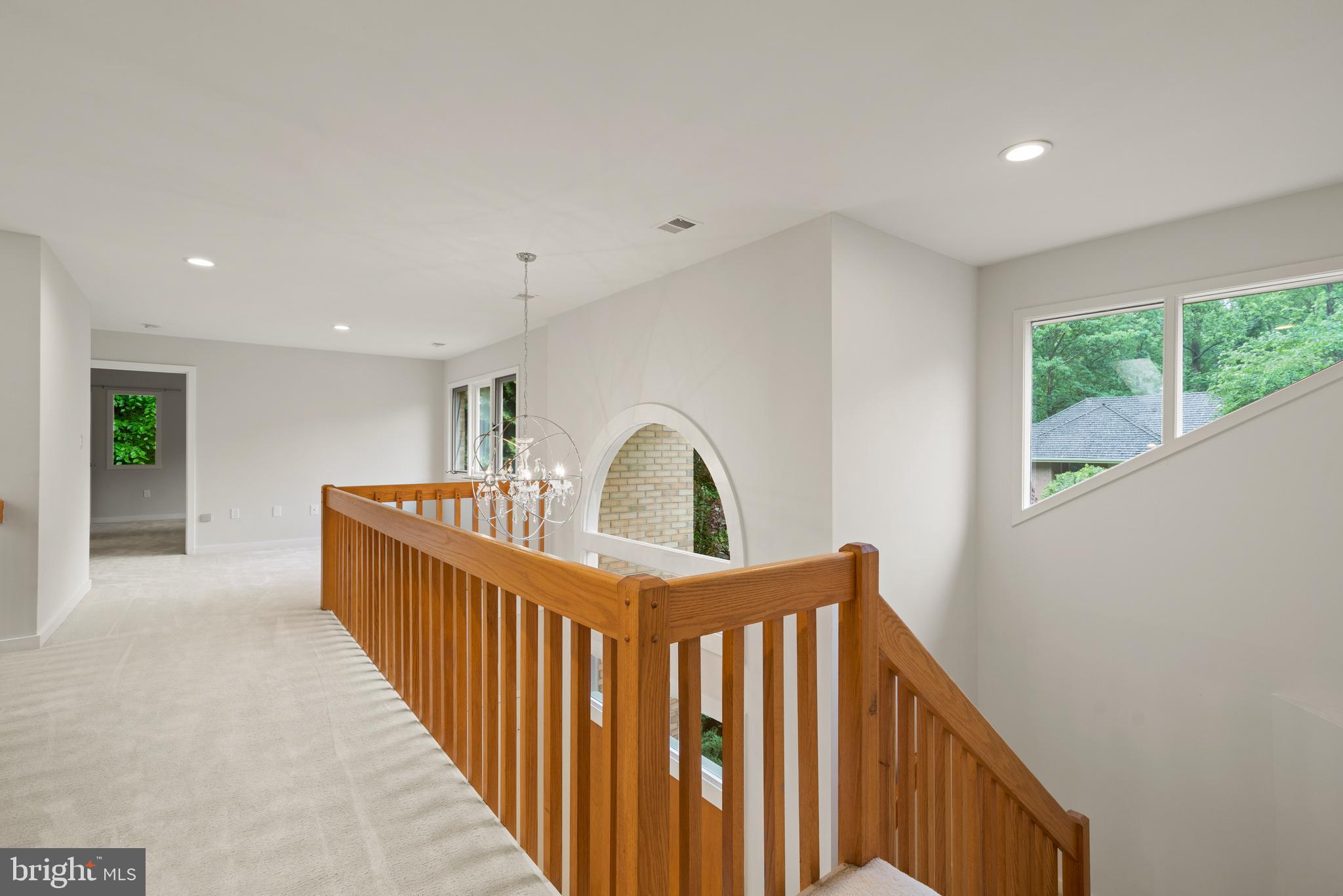 7805 Laurel Leaf Drive Potomac, MD 20854 - Photo 11 of 13 a view of a hallway with windows