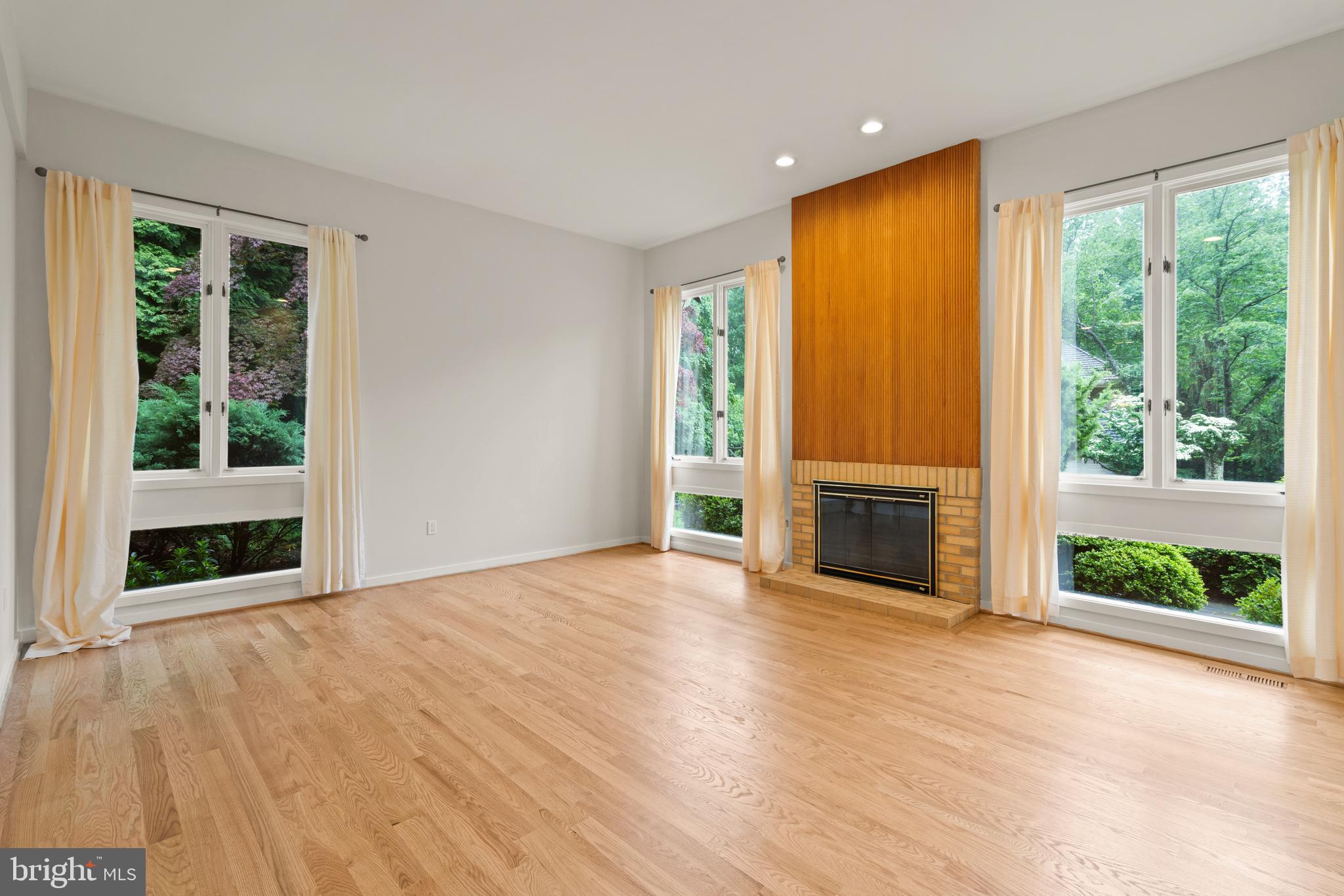 7805 Laurel Leaf Drive Potomac, MD 20854 - Photo 5 of 13 a view of an empty room with wooden floor and a window