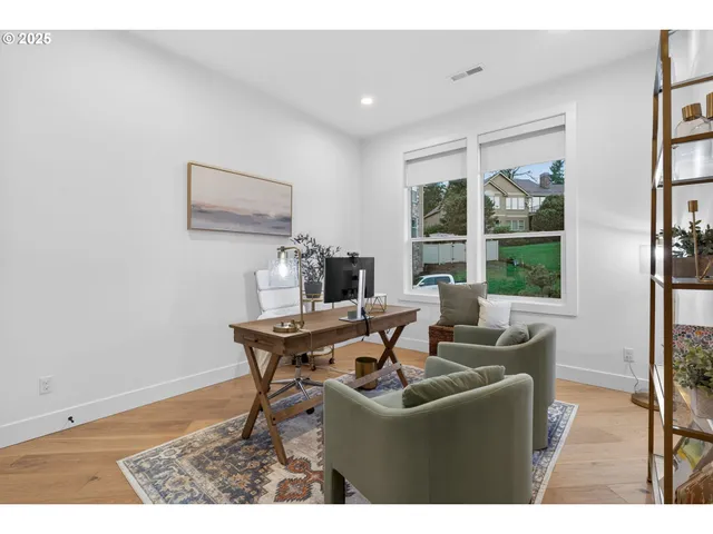 a dining room with a table and chairs