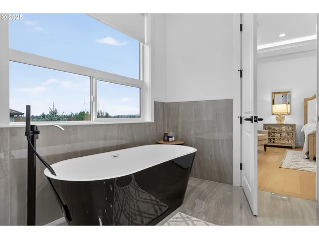 a bathroom with a sink a mirror and a bathtub