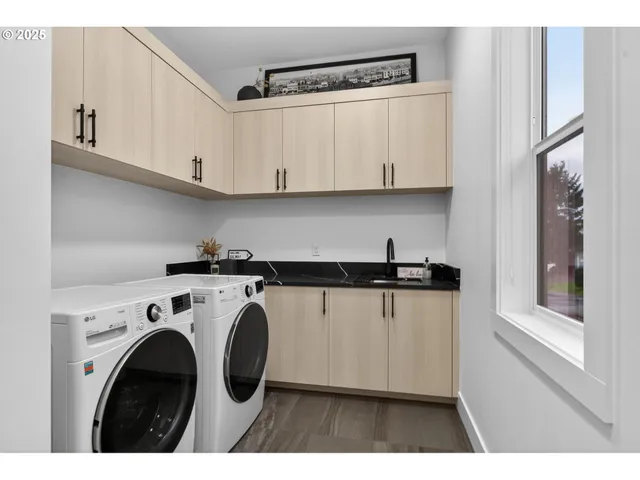a view of cabinets and washer dryer