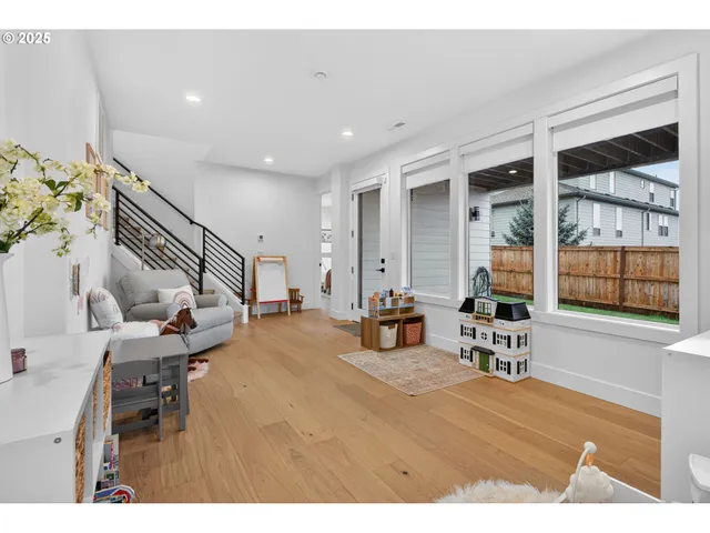 a view of a livingroom with furniture and a window