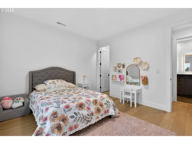 a bedroom with a bed and a table in it