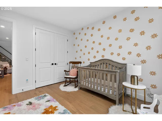 a bedroom with a bed and a chair