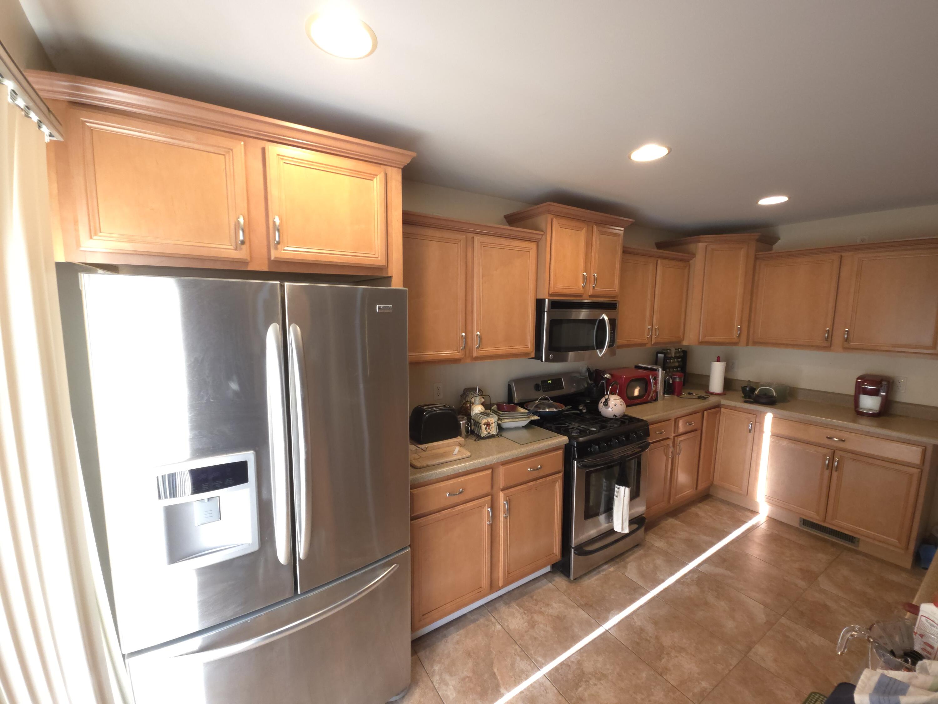 714 Governor Road Valparaiso, IN 46385 - Photo 3 of 15 a kitchen with a refrigerator stove and sink
