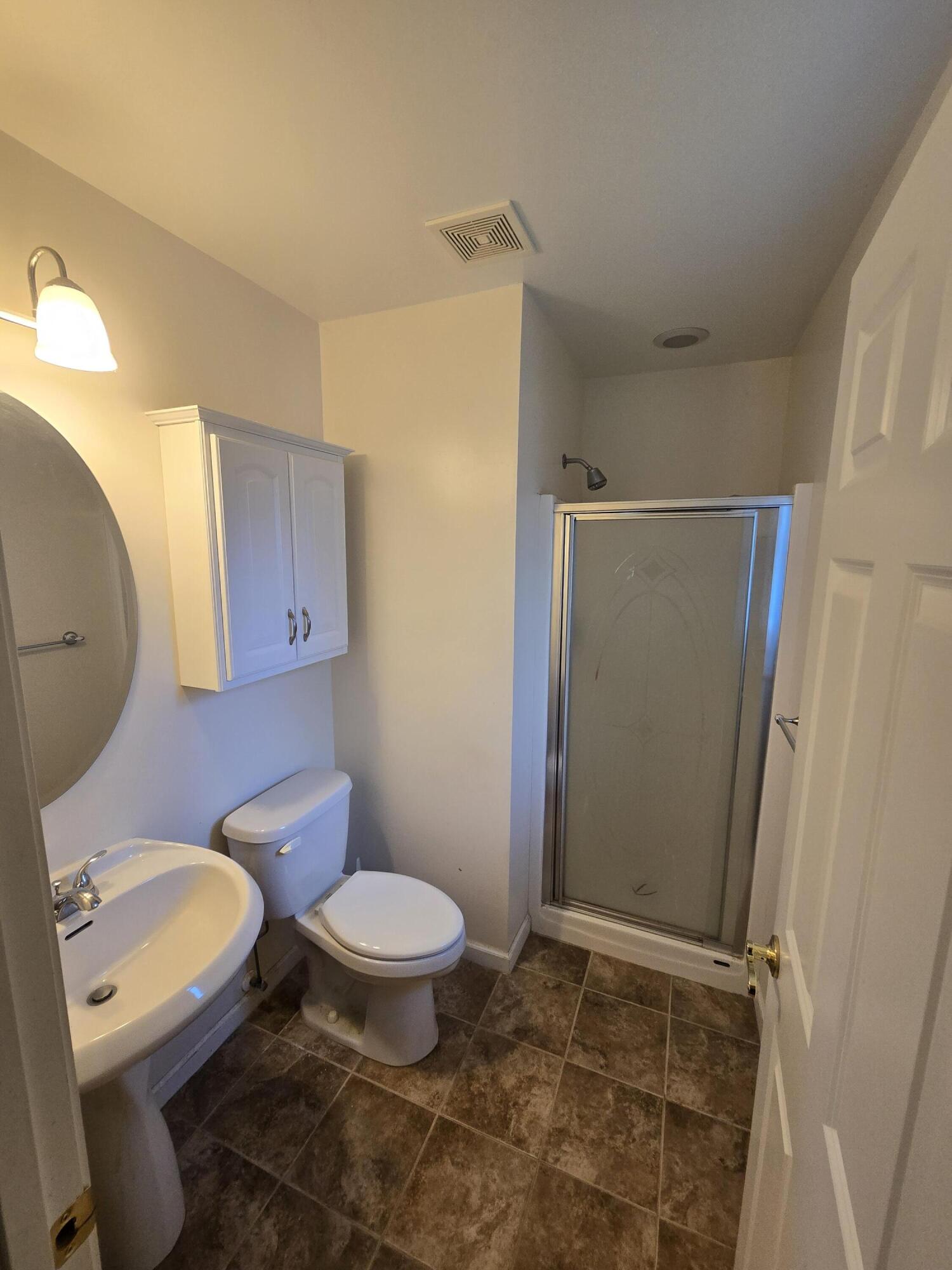 714 Governor Road Valparaiso, IN 46385 - Photo 7 of 15 a bathroom with a granite countertop toilet and a sink