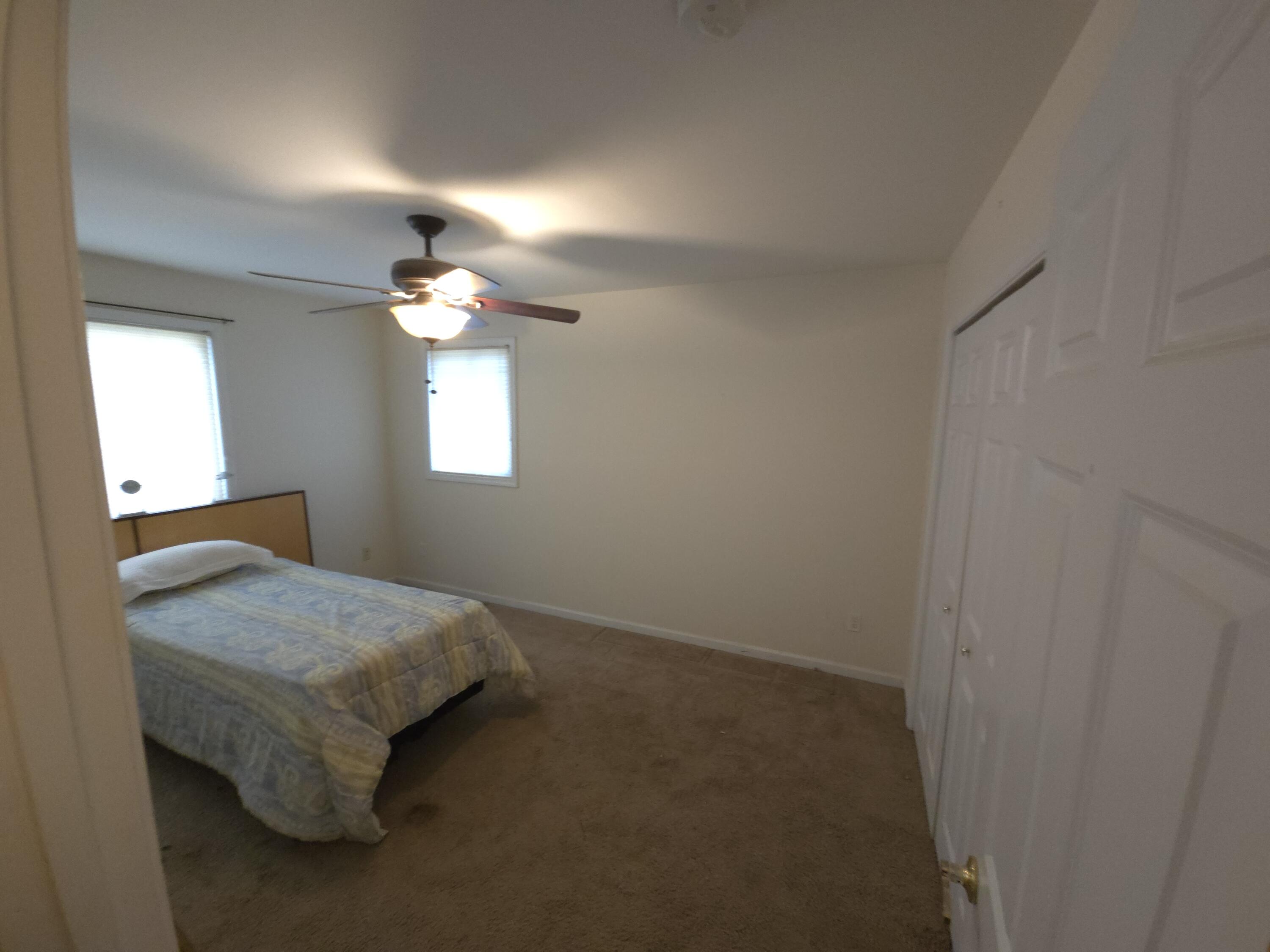 714 Governor Road Valparaiso, IN 46385 - Photo 8 of 15 a bedroom with a bed and a chandelier