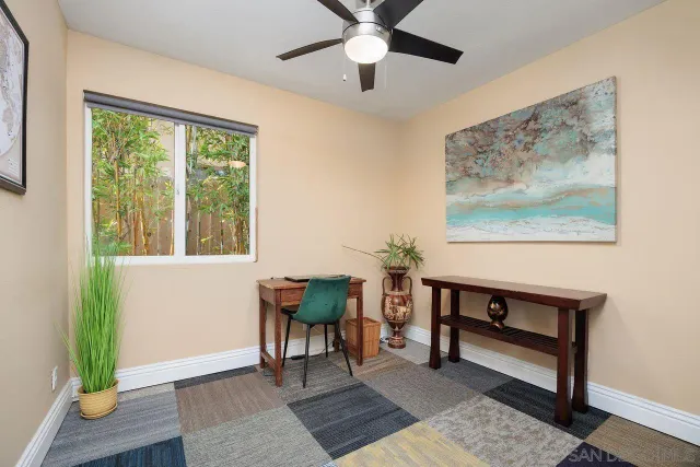 a view of a livingroom with furniture and a window