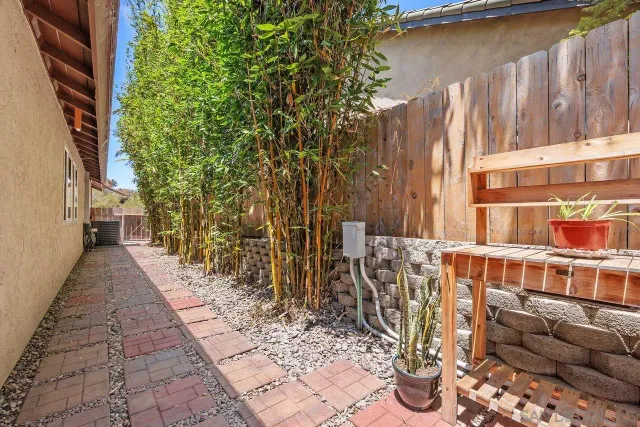a view of a chairs and tables in backyard