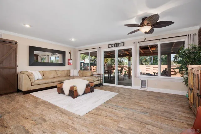 a spacious bedroom with a large bed and a large window