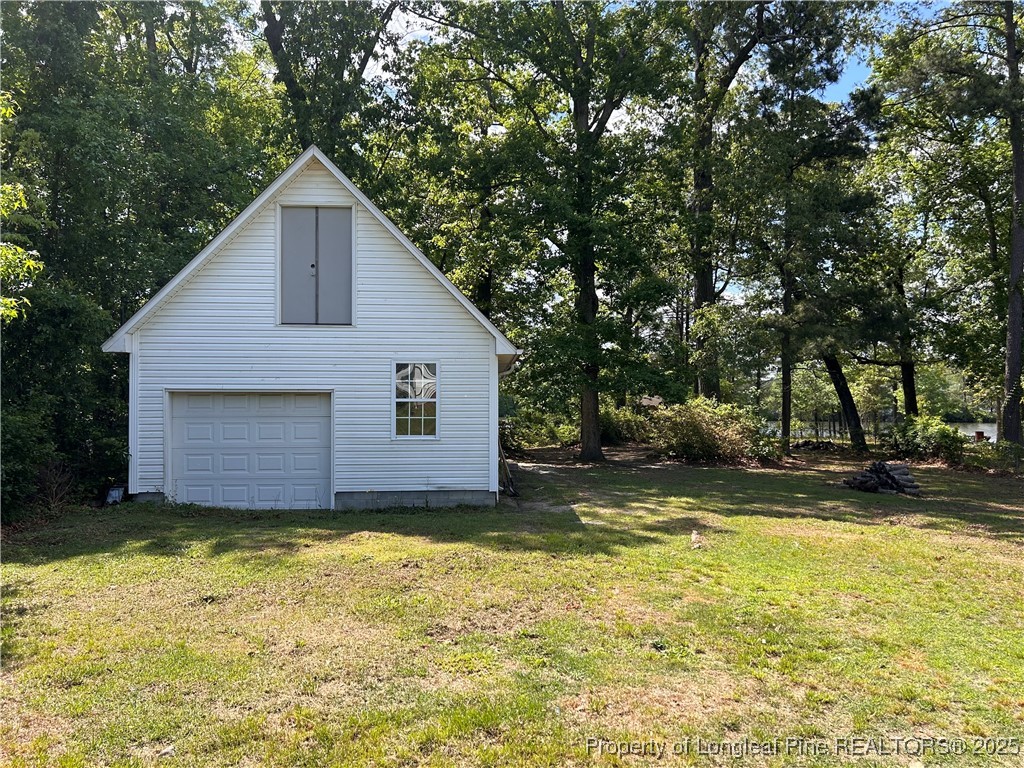 422 Lansdowne Road Fayetteville, NC 28314 - Photo 13 of 14 a view of a house with a yard