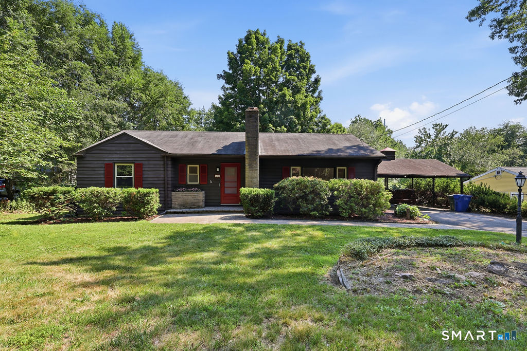 630 South Elm Street Wallingford, CT 06492 - Photo 1 of 30 a front view of a house with a yard and garage
