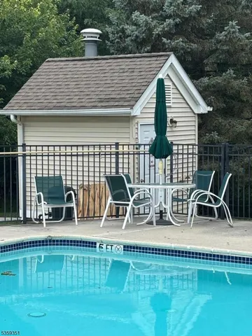 a view of a house with pool porch and patio