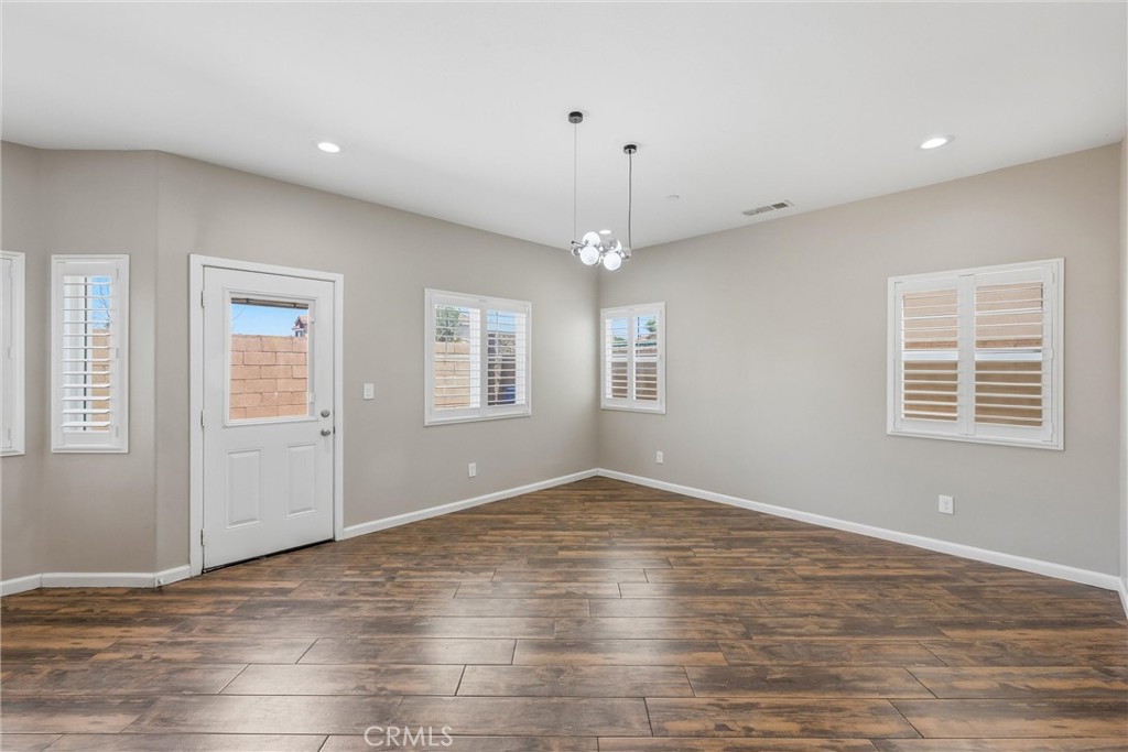 956 West Tibbot Street Rialto, CA 92377 - Photo 9 of 37 a view of empty room with wooden floor and fan