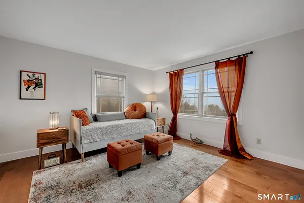 a bedroom with furniture and a window