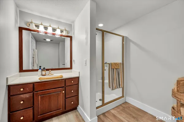 a view of walk in closet and bedroom