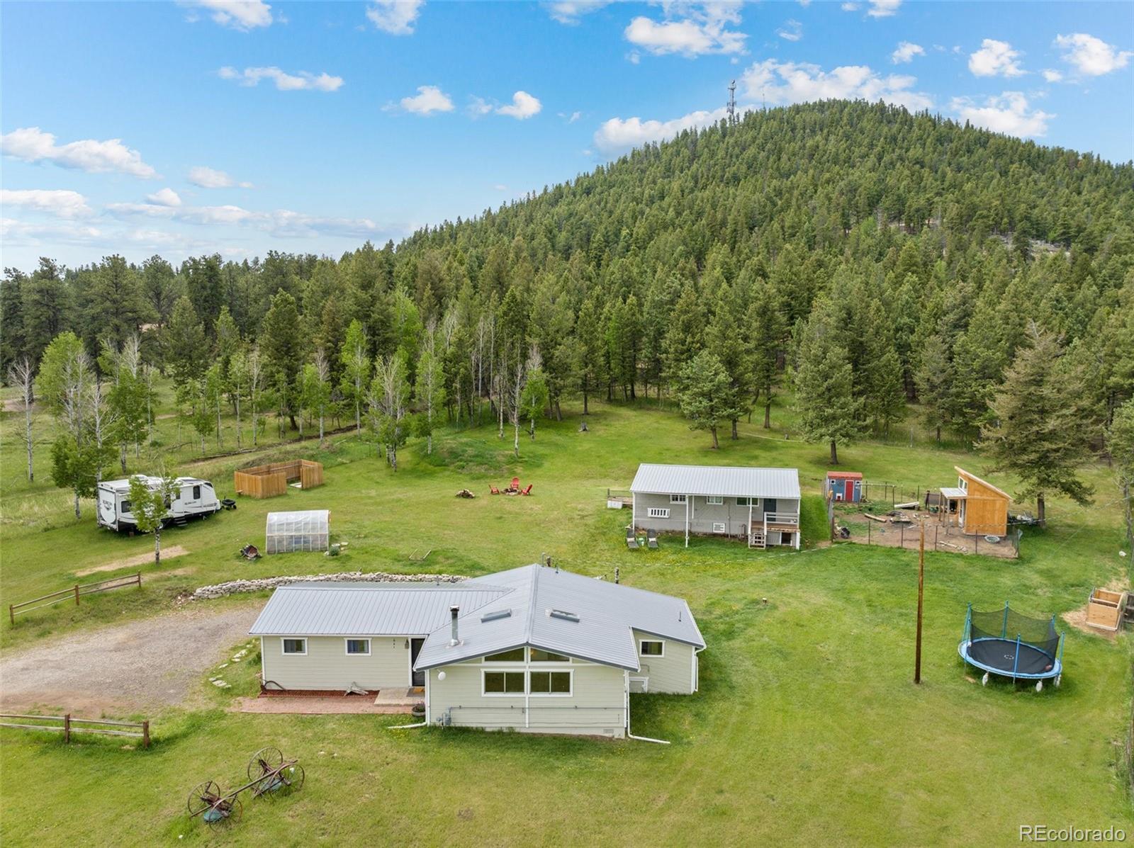 795 Burland Drive Bailey, CO 80421 - Photo 2 of 50 an aerial view of a house with garden space and street view