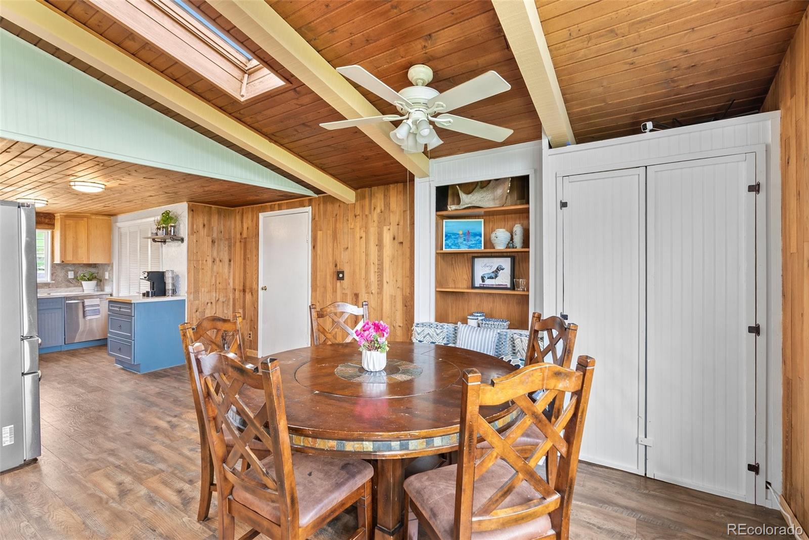 795 Burland Drive Bailey, CO 80421 - Photo 8 of 50 a view of a dining room with furniture and wooden floor