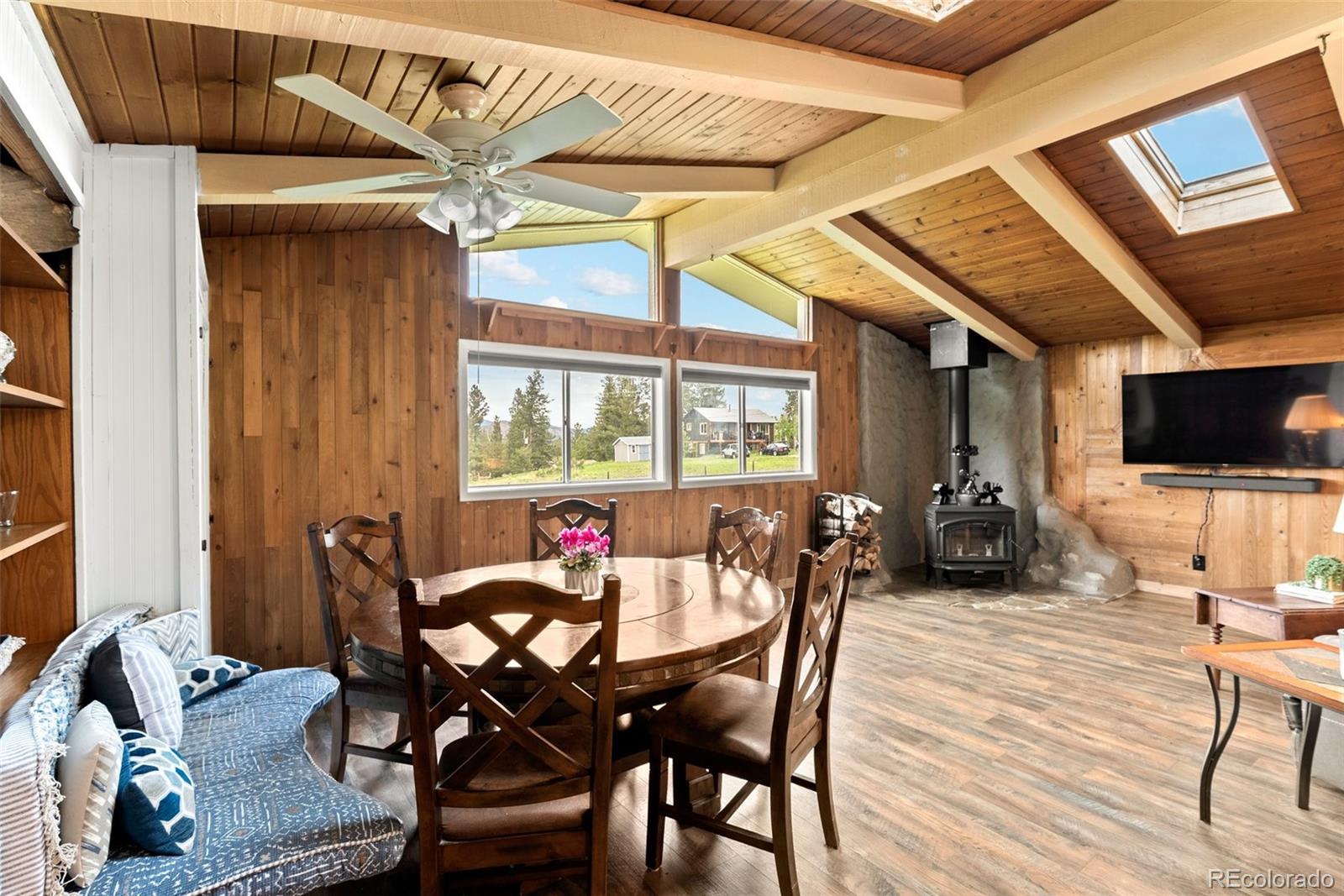 795 Burland Drive Bailey, CO 80421 - Photo 9 of 50 a view of a dining room with furniture and wooden floor