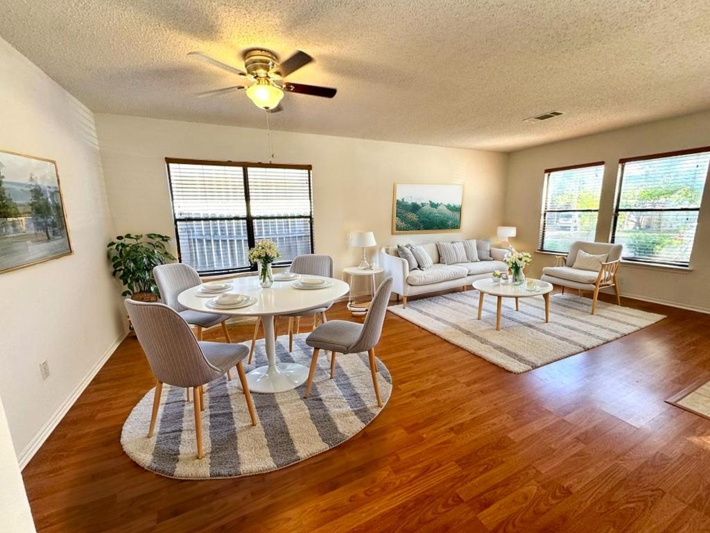 2009 Marysol Trail Cedar Park, TX 78613 - Photo 2 of 15 Dining area with healthy amount of natural light, a textured ceiling, wood finished floors, and ceiling fan