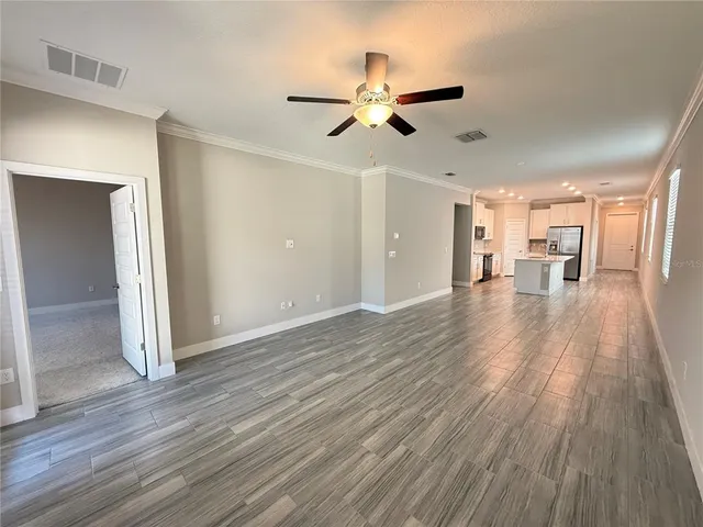 a view of a livingroom with wooden floor