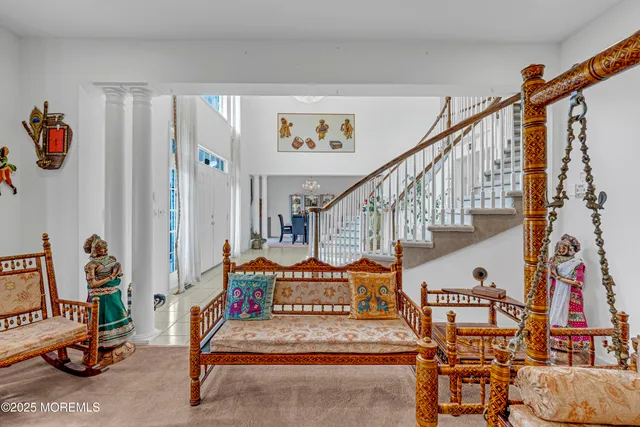 a living room with furniture and ceiling fan