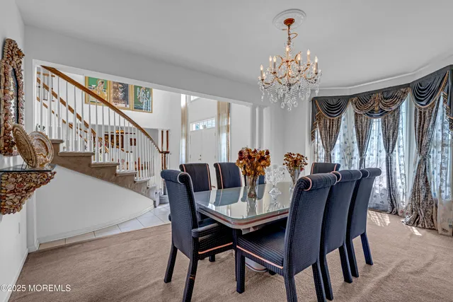 a kitchen with a sink a counter top space and stainless steel appliances