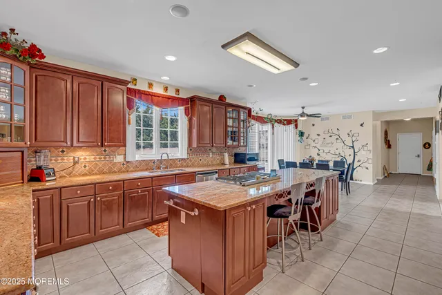 a view of staircase with lots of frames on wall