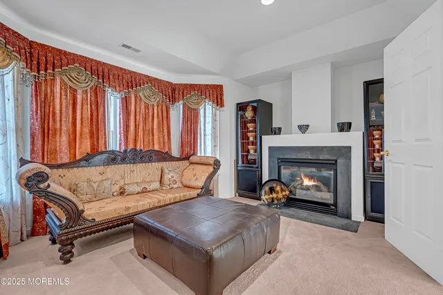 a view of a house with backyard space and sitting area