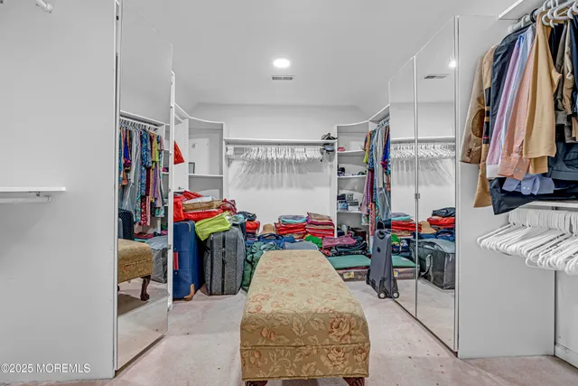 a view of a patio with couches and a fire pit