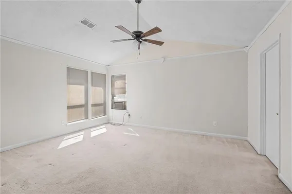 a view of an empty room with a window