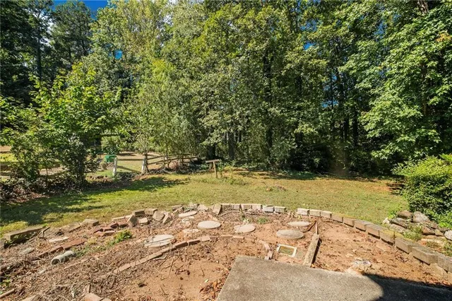 a view of a yard with trees