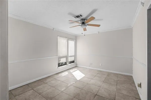 a view of an empty room and window