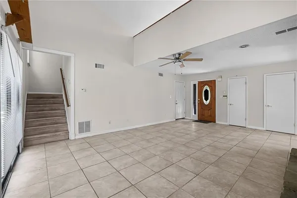 a view of an empty room and a window