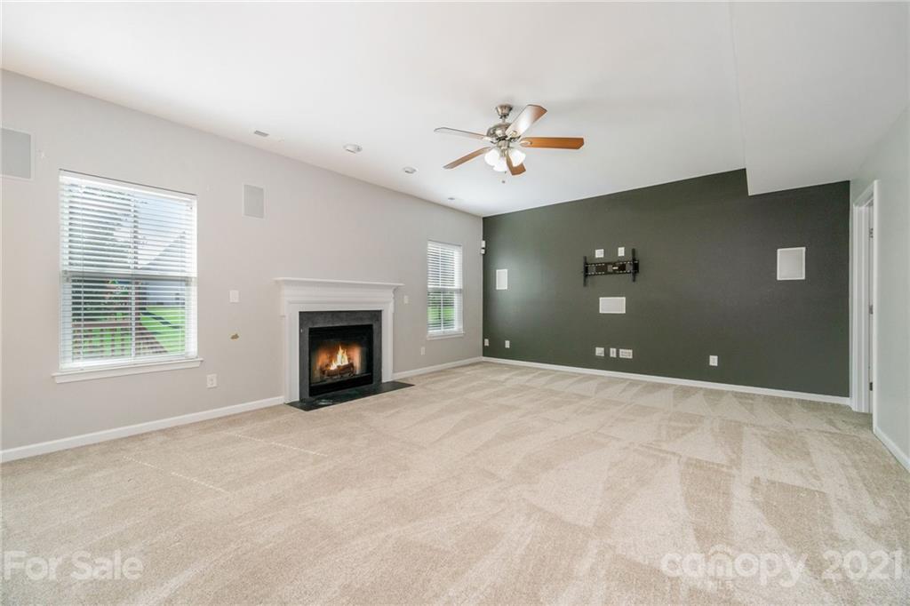 244 Lorraine Road Fort Mill, SC 29708 - Photo 12 of 33 a view of an empty room with a fireplace and a window