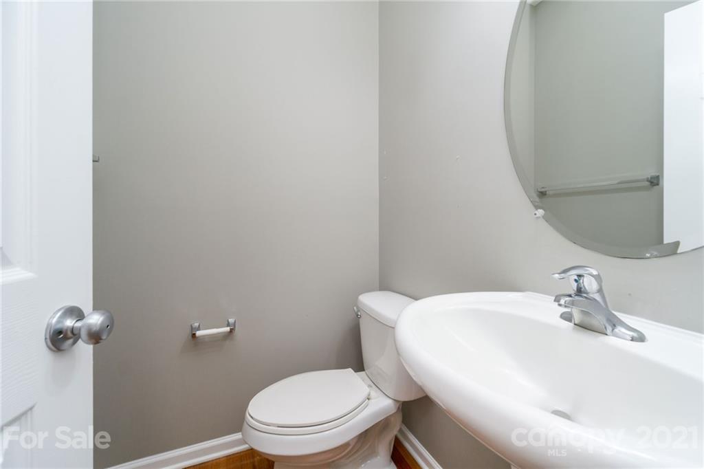 244 Lorraine Road Fort Mill, SC 29708 - Photo 15 of 33 a white toilet sitting next to a bathroom sink