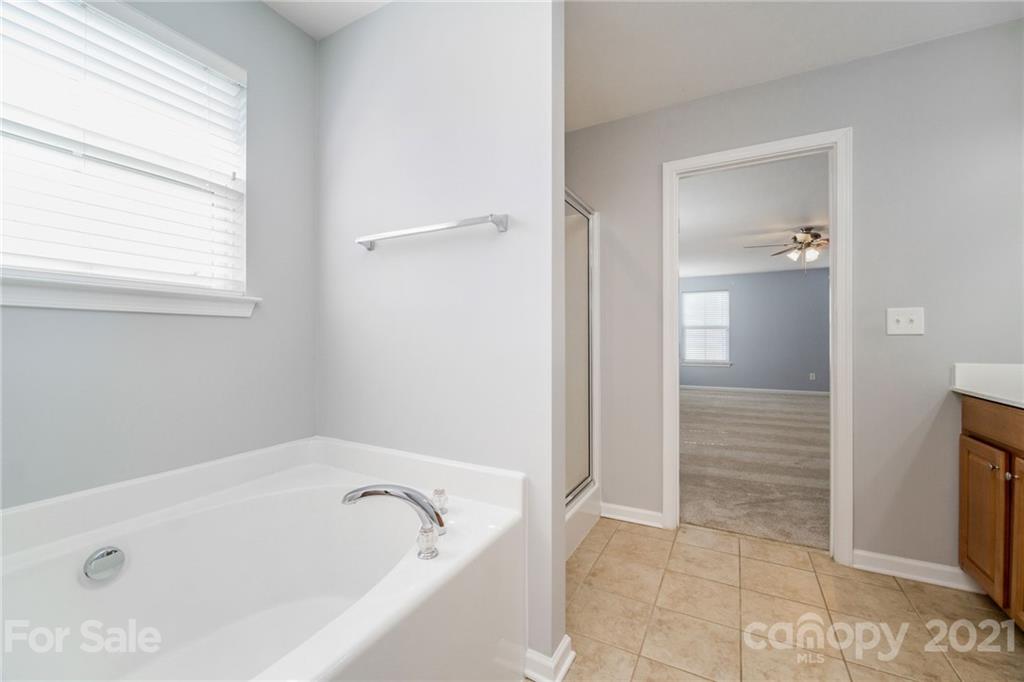 244 Lorraine Road Fort Mill, SC 29708 - Photo 20 of 33 a bathroom with a bathtub and shower
