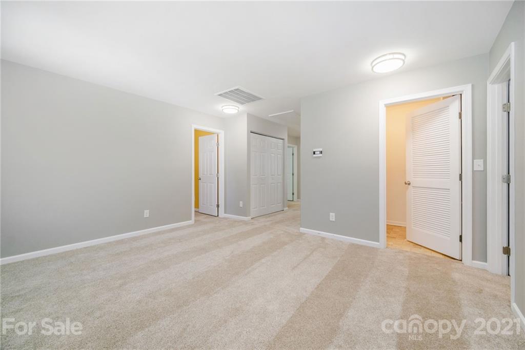 244 Lorraine Road Fort Mill, SC 29708 - Photo 24 of 33 a view of an empty room with closet and a window
