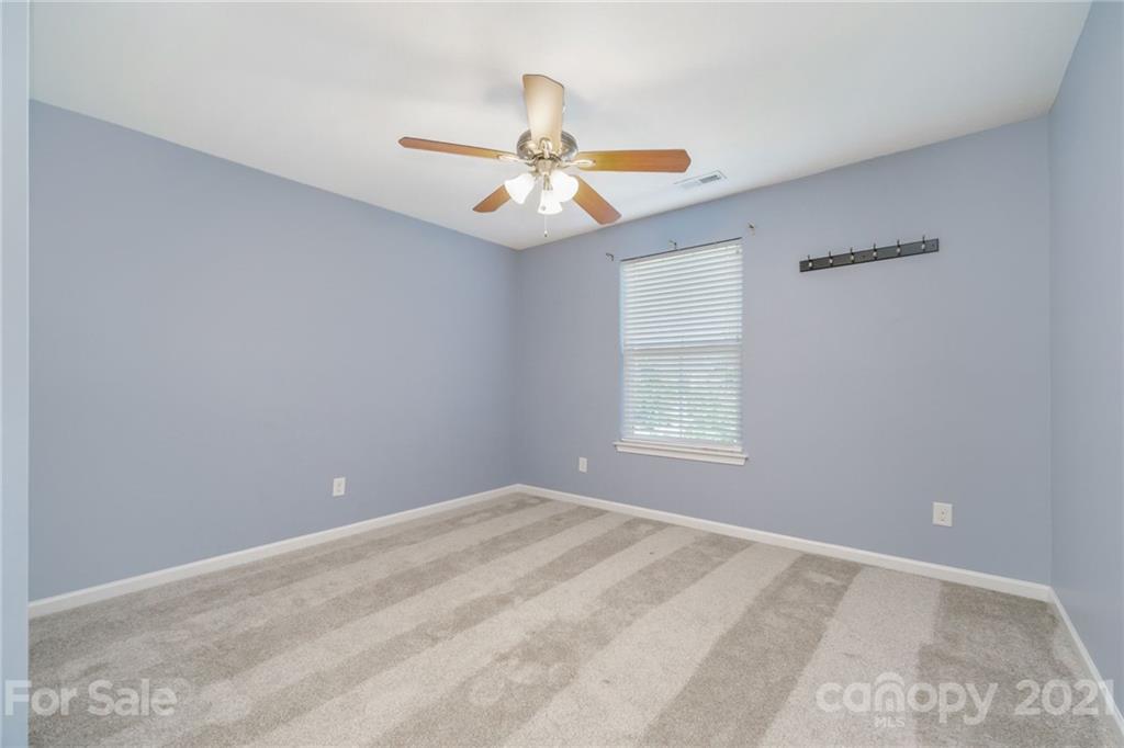 244 Lorraine Road Fort Mill, SC 29708 - Photo 25 of 33 an empty room with windows and fan