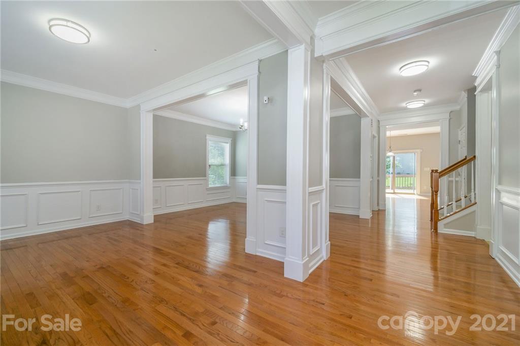 244 Lorraine Road Fort Mill, SC 29708 - Photo 7 of 33 a view of a hallway with wooden floor