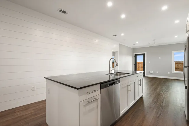 a kitchen with a sink and cabinets