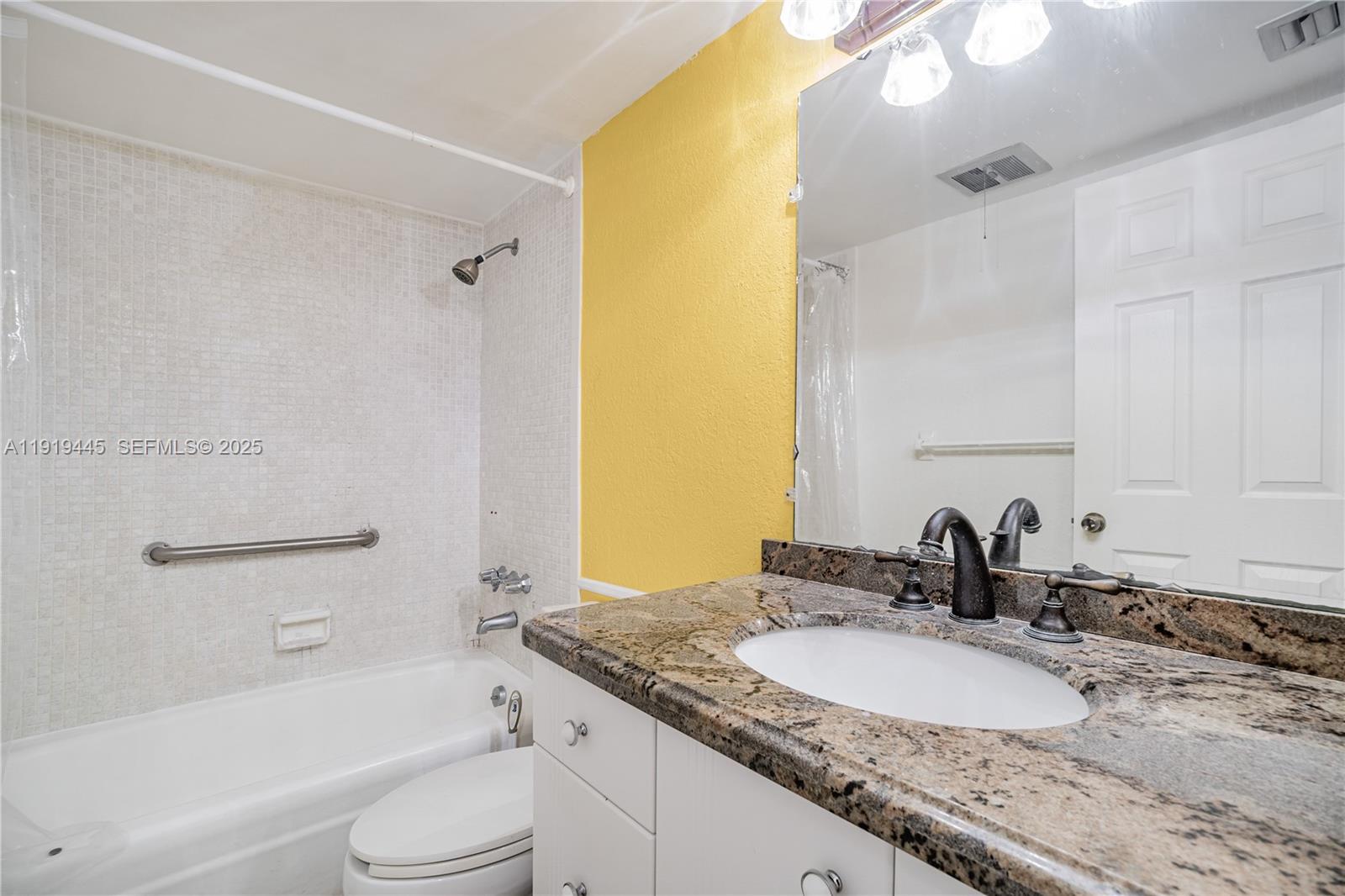 5800 Margate Boulevard, Unit 8128 Margate, FL 33063 - Photo 14 of 27 a bathroom with a granite countertop sink toilet and shower