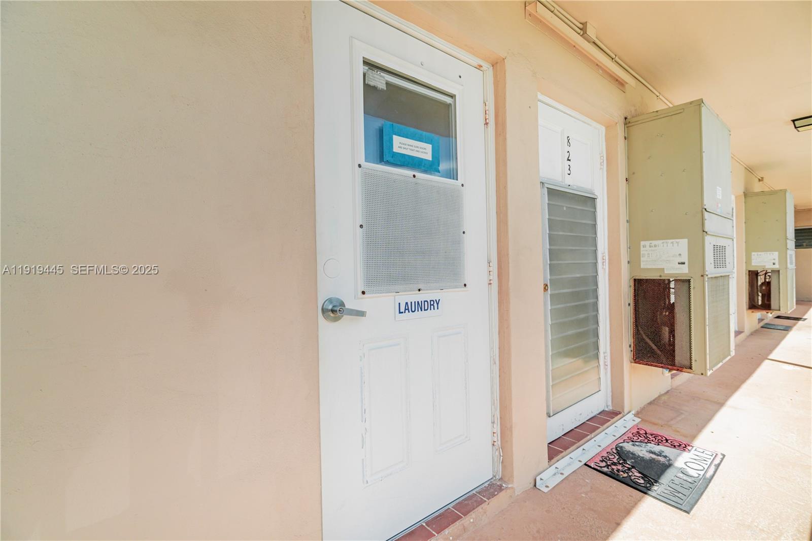 5800 Margate Boulevard, Unit 8128 Margate, FL 33063 - Photo 19 of 27 a view of a hallway with wooden floor and a bathroom