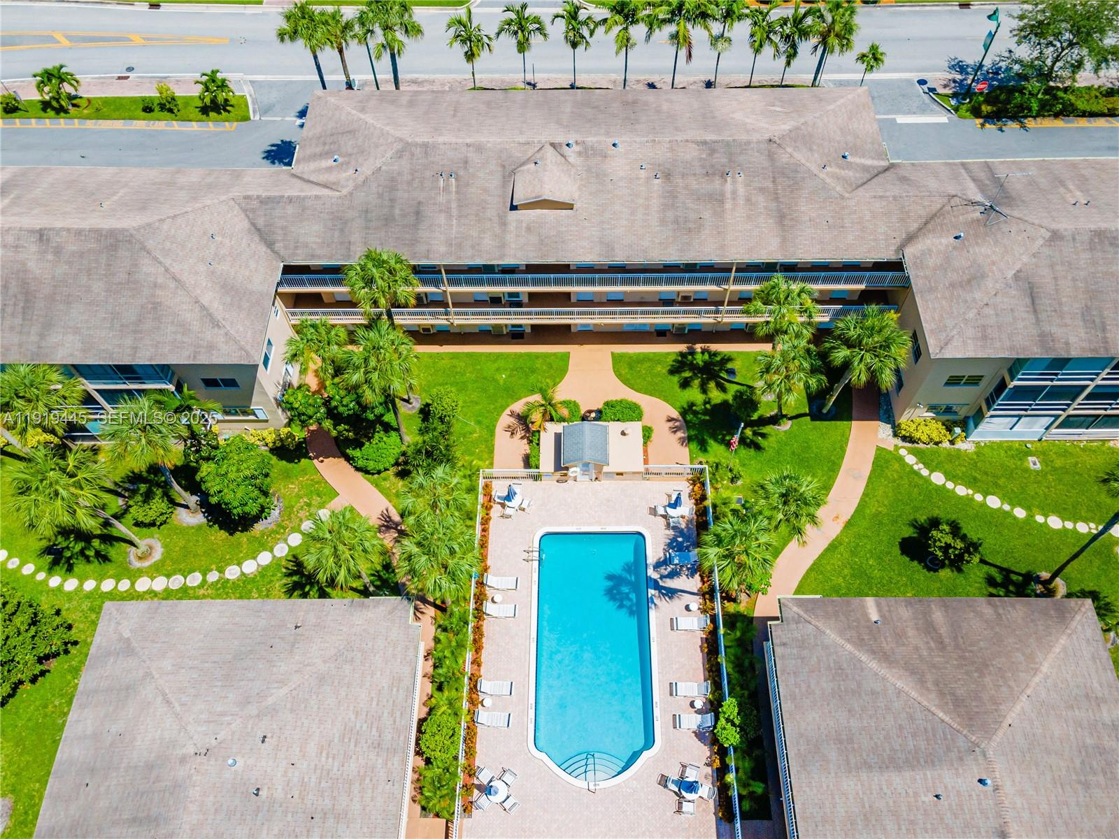 5800 Margate Boulevard, Unit 8128 Margate, FL 33063 - Photo 20 of 27 an aerial view of a house with a garden and a yard